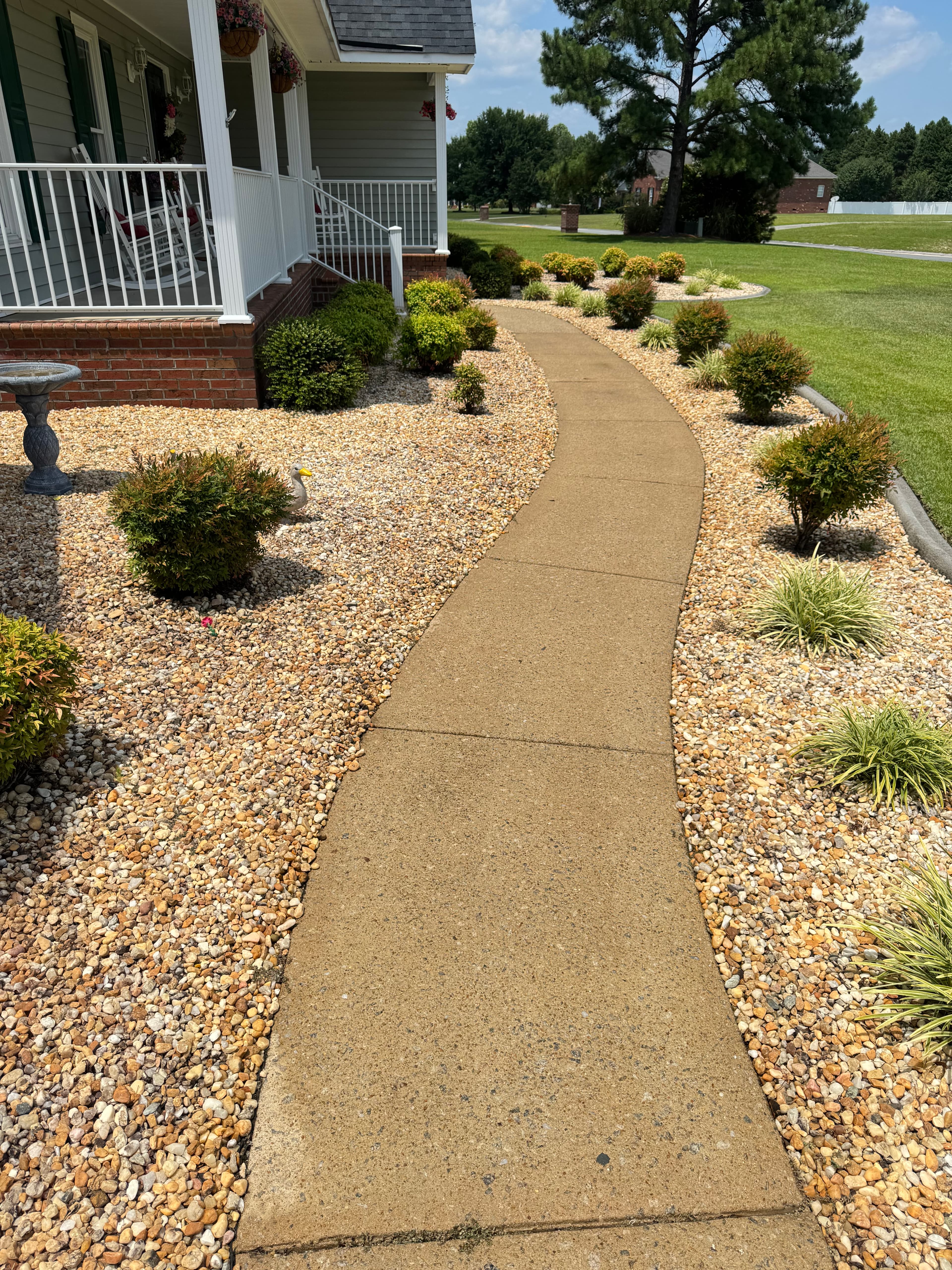 After sidewalk pressure washing by Max Pressure in Fayetteville NC — clean bright concrete walkway