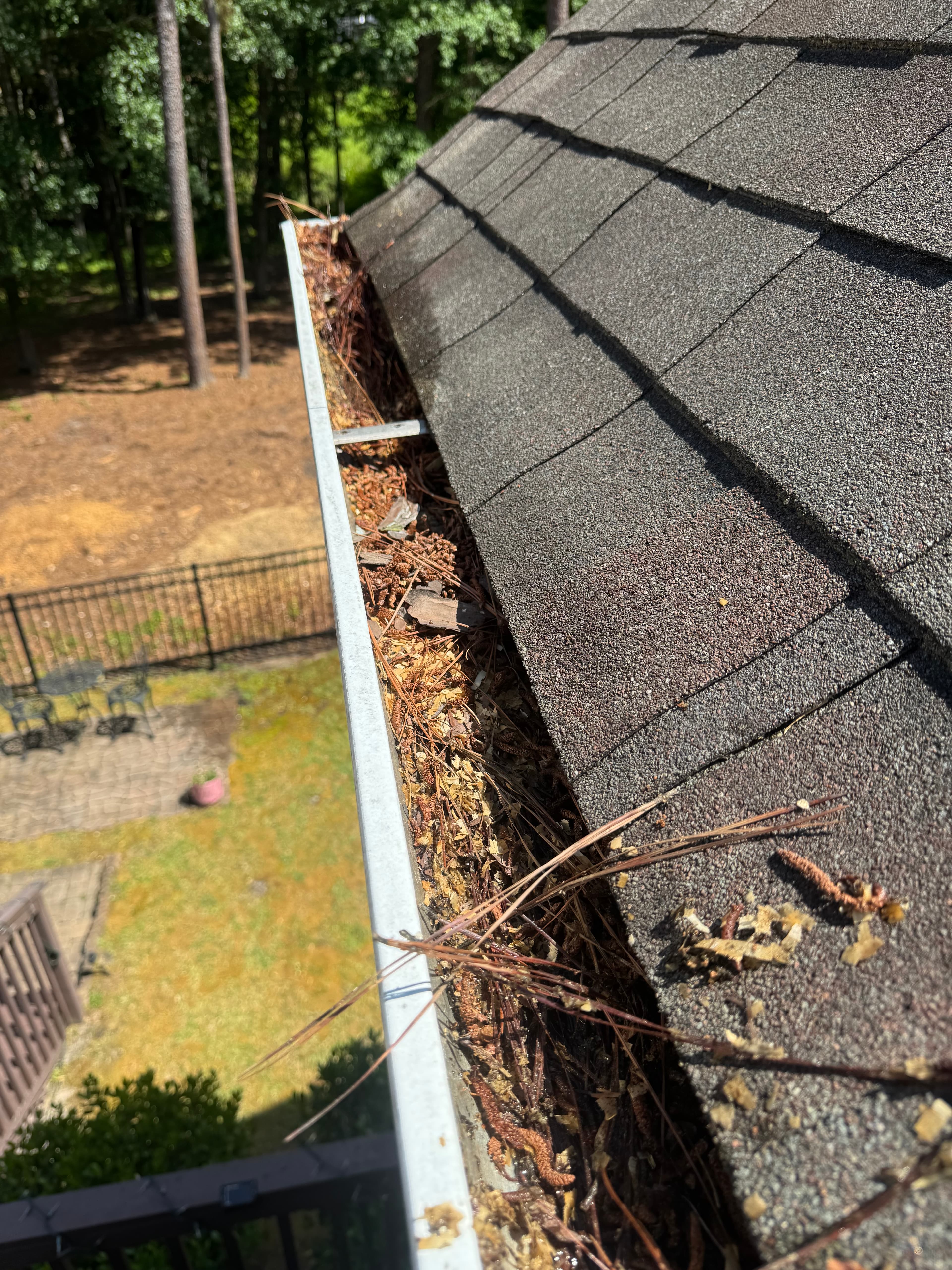 Before gutter brightening service in Fayetteville NC — stained and oxidized gutters