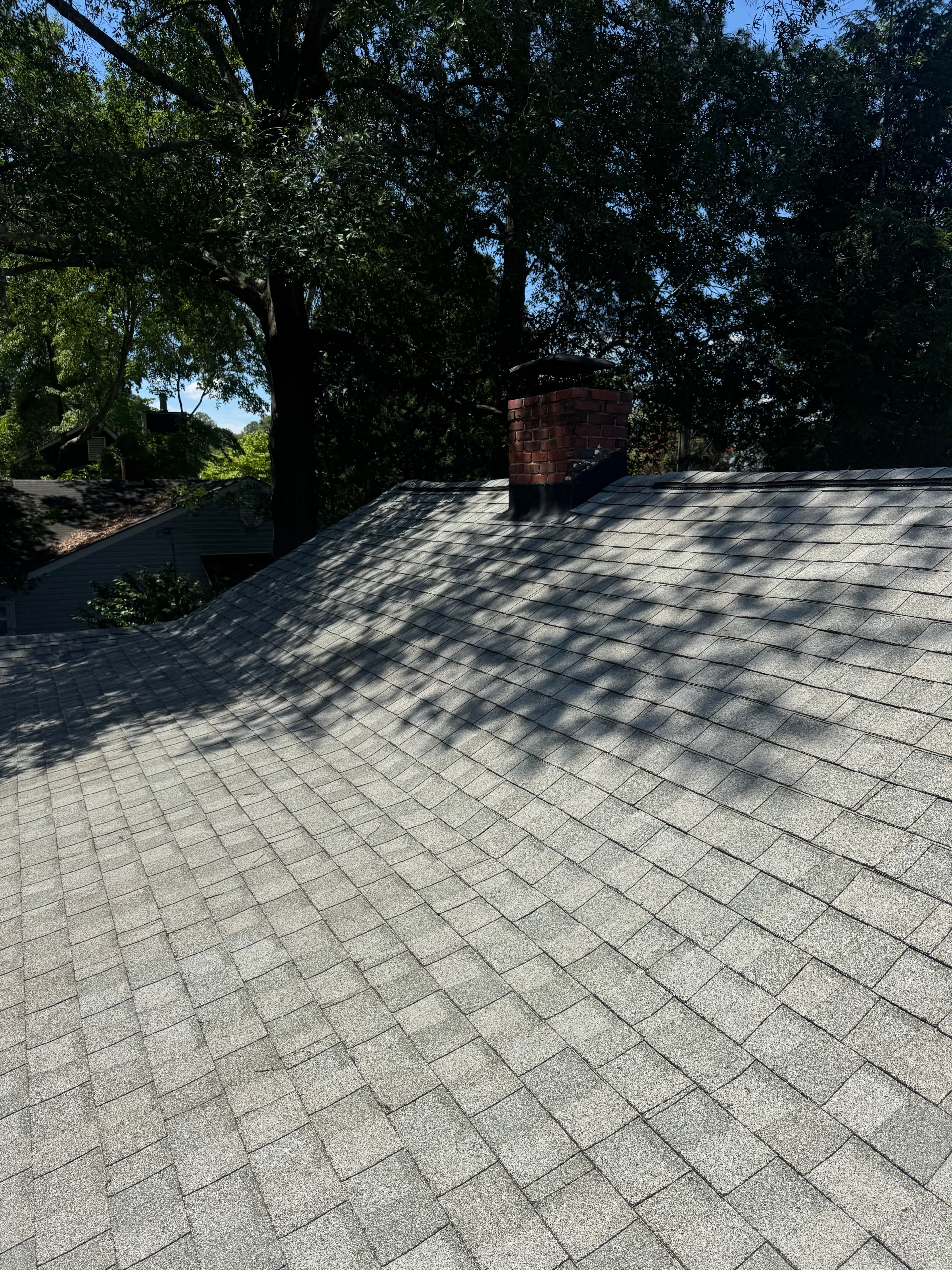 After roof soft washing by Max Pressure in Fayetteville NC — clean shingles with moss and lichen cleared