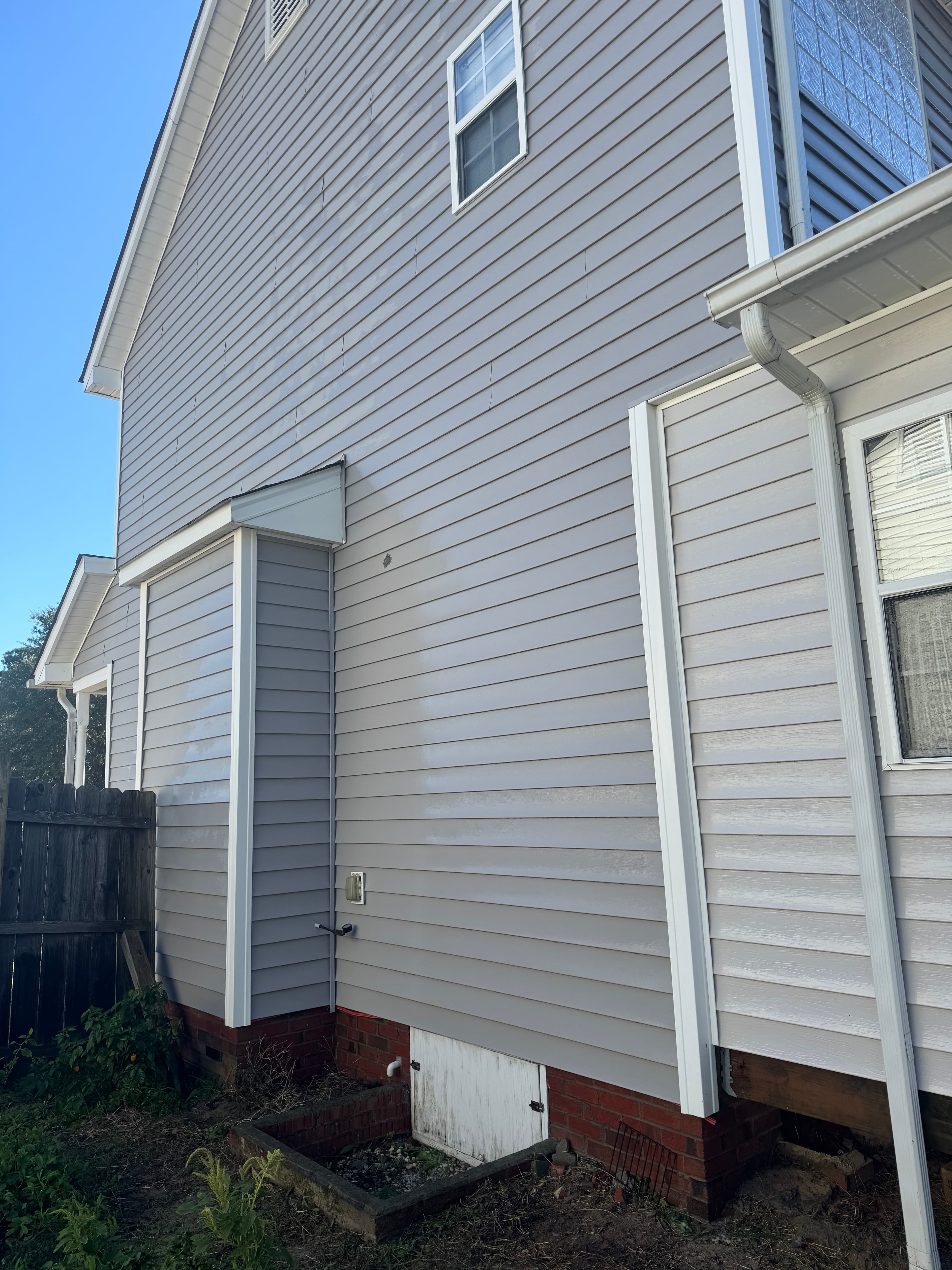 Clean home exterior after soft washing by Max Pressure in Fayetteville NC